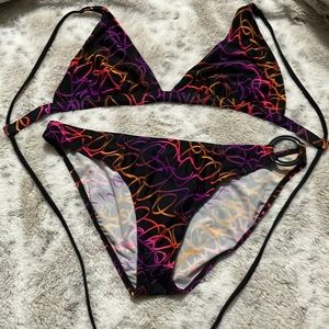 New never worn body glove bikini black and fluorescent orange, purple pink. L/xl
